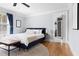 Bright primary bedroom offering hardwood floors, neutral walls, and an ensuite bath at 303 N Guthrie Ave, Durham, NC 27703