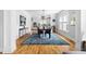 Bright dining area with hardwood floors, modern lighting, and seamless flow to the kitchen at 303 N Guthrie Ave, Durham, NC 27703