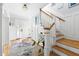 Welcoming foyer with hardwood floors, staircase, and ample natural light at 303 N Guthrie Ave, Durham, NC 27703