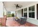 Inviting covered front porch featuring comfortable seating and stylish ceiling fan at 303 N Guthrie Ave, Durham, NC 27703