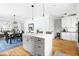 Bright kitchen with granite countertops and flowing seamlessly to the dining area and living room at 303 N Guthrie Ave, Durham, NC 27703