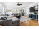 Inviting living room with hardwood floors, sectional sofa, and television at 303 N Guthrie Ave, Durham, NC 27703