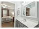 Bathroom featuring shower with tub, vanity, and adjacent bedroom at 3050 Trailwood Pines Ln # 101, Raleigh, NC 27603