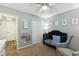 Light-filled Bedroom featuring a dark wood crib, soft glider, and ample storage at 3050 Trailwood Pines Ln # 101, Raleigh, NC 27603