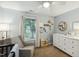 Serene Bedroom with a comfortable glider, dresser, and charming decor at 3050 Trailwood Pines Ln # 101, Raleigh, NC 27603