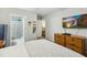 Bedroom with ensuite bathroom, ceiling fan, and TV at 3050 Trailwood Pines Ln # 101, Raleigh, NC 27603