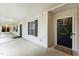 Inviting condo entrance with a wreath on the door and well-maintained common area at 3050 Trailwood Pines Ln # 101, Raleigh, NC 27603