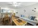 Spacious living and dining area featuring hardwood floors, neutral decor, and abundant natural light at 3050 Trailwood Pines Ln # 101, Raleigh, NC 27603