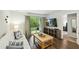 Cozy living room with a view to the patio, contemporary furnishings, and natural light at 3050 Trailwood Pines Ln # 101, Raleigh, NC 27603