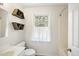 Bathroom featuring open shelving and natural light at 323 Brandermill Dr, Durham, NC 27713