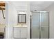 Bathroom featuring a vanity, a mirrored medicine cabinet, and a shower with glass doors at 323 Brandermill Dr, Durham, NC 27713