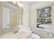 Bright bathroom featuring a vanity with chrome fixtures, a large mirror, and a shower at 323 Brandermill Dr, Durham, NC 27713