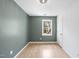 Bedroom featuring a window with natural light, hardwood floors, and a neutral color scheme at 323 Brandermill Dr, Durham, NC 27713