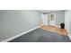 Bedroom featuring neutral walls, a door to the outside, and carpet flooring at 323 Brandermill Dr, Durham, NC 27713