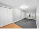 Bedroom with light-colored walls, hardwood flooring, and ample closet space with mirrored doors at 323 Brandermill Dr, Durham, NC 27713