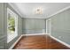 Classic dining room featuring hardwood floors, decorative molding, and window for plenty of natural light at 323 Brandermill Dr, Durham, NC 27713