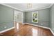 Elegant dining room featuring hardwood floors, decorative molding, and a classic chandelier fixture at 323 Brandermill Dr, Durham, NC 27713
