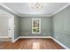 Traditional dining room features hardwood floors, decorative molding, and a chandelier fixture at 323 Brandermill Dr, Durham, NC 27713