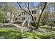 Charming two-story home with blue shutters, a brick pathway, and a meticulously maintained front yard at 323 Brandermill Dr, Durham, NC 27713