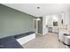 Eat-in kitchen area with built-in seating and white cabinets, stainless steel appliances, and granite countertops at 323 Brandermill Dr, Durham, NC 27713