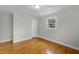 Bedroom featuring hardwood floors and one window at 324 Dare St, Burlington, NC 27217