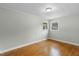 Bedroom featuring hardwood floors, natural light from the double windows at 324 Dare St, Burlington, NC 27217