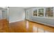 Open living room with hardwood floors, a front door, and natural light at 324 Dare St, Burlington, NC 27217