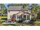 Open backyard featuring a patio with seating, mature trees, a grill, and a sunroom at 3424 English Cir, Willow Springs, NC 27592