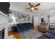 Comfortable living area with hardwood floors, a fireplace, and an open layout to the kitchen at 3424 English Cir, Willow Springs, NC 27592