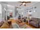 Spacious living room featuring hardwood floors, a staircase, and neutral gray wall color at 3424 English Cir, Willow Springs, NC 27592