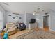 Relaxing living room with plush chairs, ceiling fan, TV, and a patterned rug at 3424 English Cir, Willow Springs, NC 27592