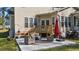 Outdoor patio featuring comfortable seating, an umbrella, and a grill, perfect for relaxation at 3424 English Cir, Willow Springs, NC 27592