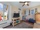 Cozy sunroom with a ceiling fan, lots of windows, and hardwood floors at 3424 English Cir, Willow Springs, NC 27592