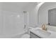 Well-lit bathroom featuring modern gold fixtures, granite countertops, and bathtub at 3533 N Way Dr, Zebulon, NC 27597