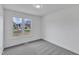 Cozy bedroom featuring a large window offering abundant natural light and neighborhood views at 3533 N Way Dr, Zebulon, NC 27597