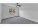 Bright bedroom featuring a ceiling fan and a large window with backyard views at 3533 N Way Dr, Zebulon, NC 27597