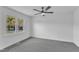 Bright bedroom featuring a ceiling fan and a large window at 3533 N Way Dr, Zebulon, NC 27597