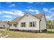 Inviting single-story home featuring beautiful landscaping and a charming covered front porch at 3533 N Way Dr, Zebulon, NC 27597