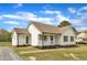 Charming single-story home with a well-maintained lawn, blue front door, and inviting front porch at 3533 N Way Dr, Zebulon, NC 27597