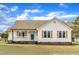 Charming single-story home with a welcoming front porch and well-maintained lawn at 3533 N Way Dr, Zebulon, NC 27597