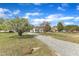 Large lot with long gravel driveway and beautiful landscaping at 3533 N Way Dr, Zebulon, NC 27597
