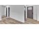Wide hallway with gray interior doors, offering a seamless transition between rooms at 3533 N Way Dr, Zebulon, NC 27597