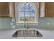 Close up of a modern kitchen sink with a stainless steel faucet and quartz countertops at 3533 N Way Dr, Zebulon, NC 27597