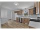 Bright kitchen featuring wooden cabinetry, stainless steel appliances, and a stylish backsplash at 3533 N Way Dr, Zebulon, NC 27597