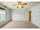 Bedroom featuring neutral carpet, two closets, and light blue walls at 367 Windham Way, Clayton, NC 27527