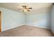 Bedroom features neutral carpet, floating shelves, and light blue walls at 367 Windham Way, Clayton, NC 27527