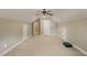 An oversized bonus room with neutral carpet, a ceiling fan, and access to other rooms at 367 Windham Way, Clayton, NC 27527