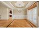 Spacious dining room with decorative molding, hardwood floors, and large windows, perfect for entertaining at 367 Windham Way, Clayton, NC 27527