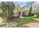 Charming home features a stone accent porch with mature landscaping and a curved walkway at 367 Windham Way, Clayton, NC 27527
