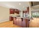 Kitchen features a large granite island, overhead lighting, and modern appliances at 367 Windham Way, Clayton, NC 27527